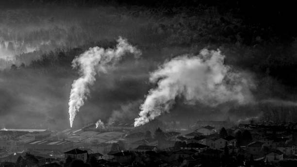istock Smoke from industry in winter in black and white 955824704