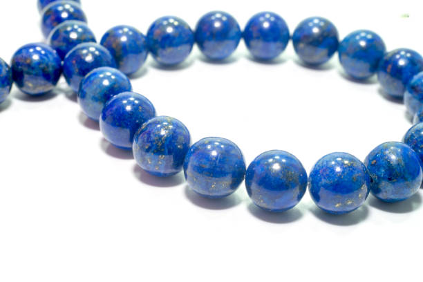 istock lapis lazuli bracelet isolated on white background. 955832188