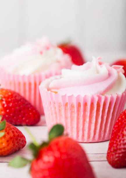 istock Cupcake muffin with strawberry cream dessert 955839476