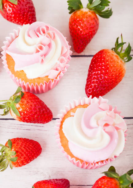 istock Cupcake muffin with strawberry cream dessert 955840442