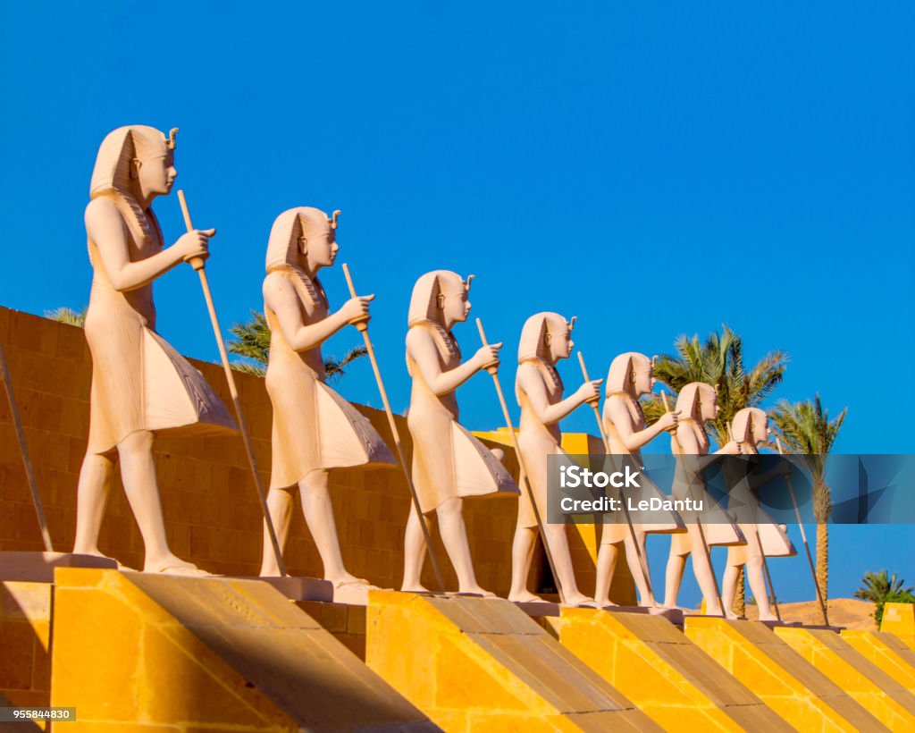 Egyptian warriors statues against the blue sky and standing along the route Egyptian warriors statues against the blue sky standing along the route in Sahl Hasheesh area Egypt Stock Photo