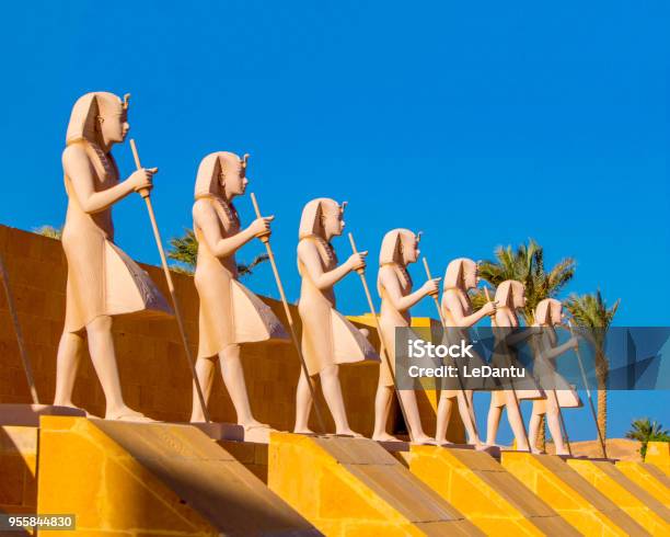 Egyptian Warriors Statues Against The Blue Sky And Standing Along The Route Stock Photo - Download Image Now