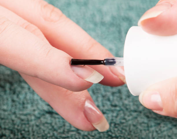 istock Woman making manicure, using nail polish 955854822