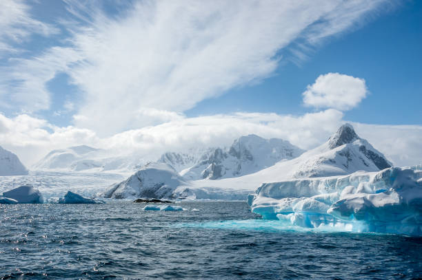 istock Turquoise icebergs, bright white snow, glaciers and clouds.  Penola Strait 955854994