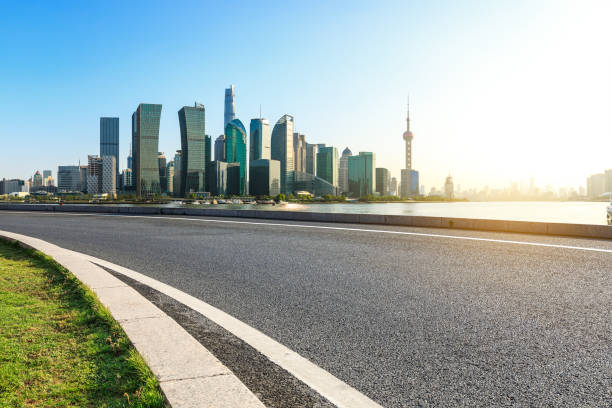 istock empty asphalt road and city skyline in shanghai at sunset 955855816