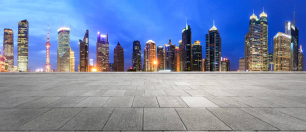 istock empty square floor and city skyline scene in shanghai at night 955860198