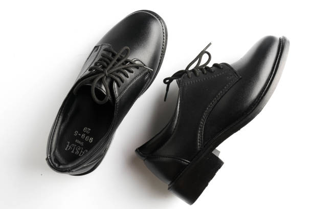 istock black patent leather men shoes against white background 955860434