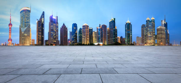 istock empty square floor and city skyline scene in shanghai at night 955860874