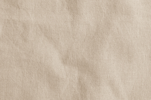 Harpillera arpillera tejida fondo de textura de tela en color marrón crema beige photo