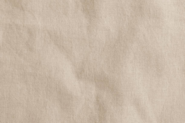 sfondo in tessuto intrecciato sackcloth dell'assia in colore marrone crema beige - tablecloth foto e immagini stock