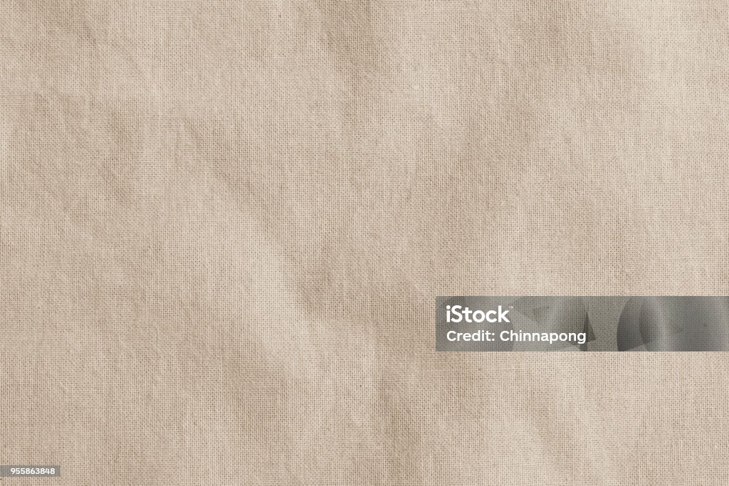 Hessian sackcloth woven fabric texture background in beige cream brown color Textile Stock Photo