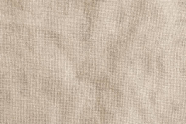 hessian sackcloth woven fabric texture background in beige cream brown color - musselina imagens e fotografias de stock