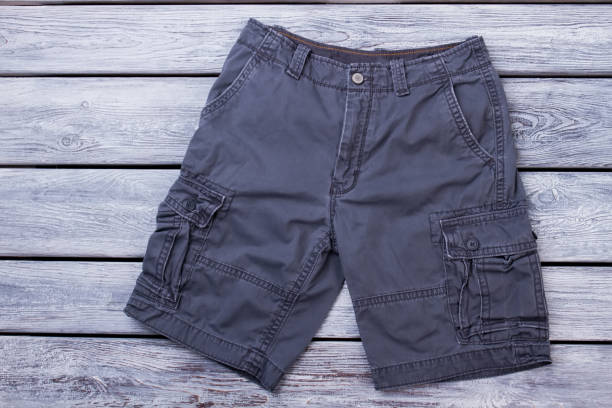 istock Black male shorts on wood. 955879722