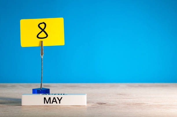 istock May 8th. Day 8 of may month, calendar on little yellow tag. Spring time. Empty space for text, mockup or template 955883106