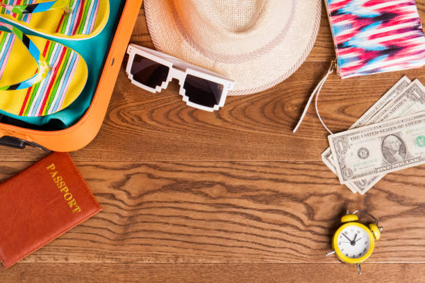 istock Summer female clothes on wooden table. 955886480