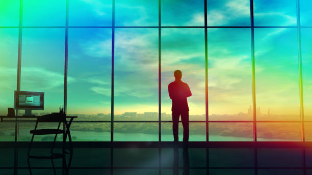 istock Men in the huge office in front of large windows 955889754
