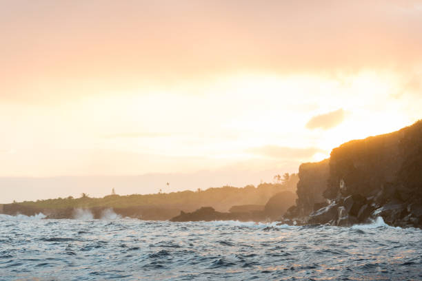 istock Hawaii Sunset over Volcanic Coastal Landscape by Pacific Ocean 955890324