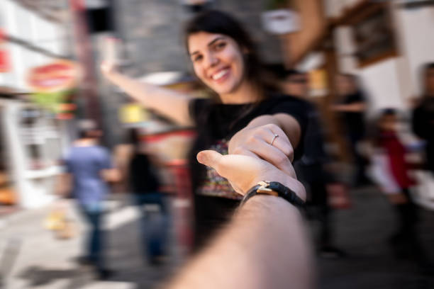 istock Couple Holding Hands and walking at Small Village 955890766
