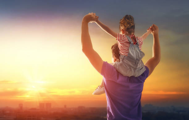 istock family at sunset 955895746