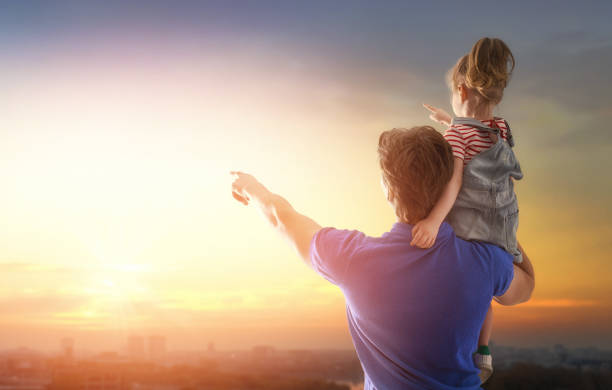 istock family at sunset 955895750