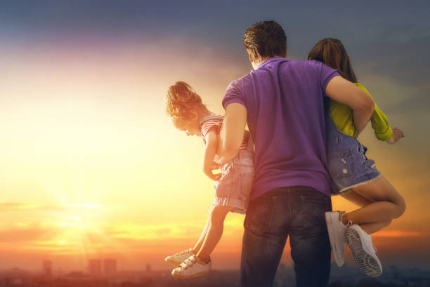istock family at sunset 955895756