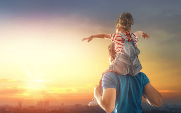 istock family at sunset 955895768