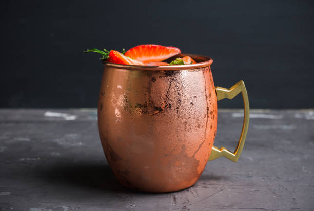 istock Strawberry moscow mule on thr rustic background 955900200