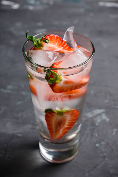 istock Cocktail with ripe strawberry on the rustic background 955902808