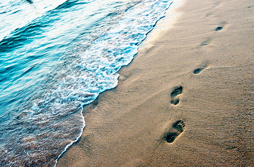 Footprints on the soft beach
