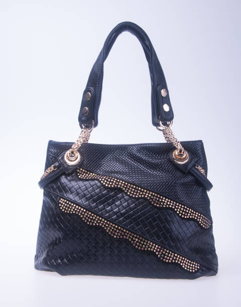 istock woman handbag on a background 955904308