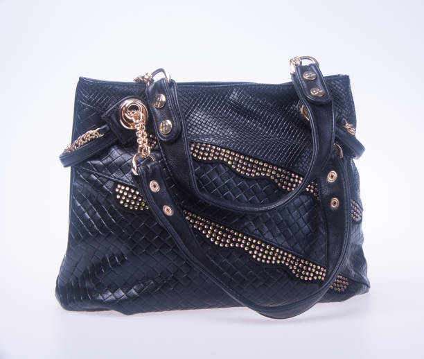 istock woman handbag on a background 955906568