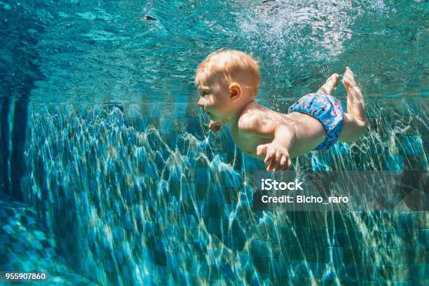 Child Jump Underwater Into Swimming Pool Stock Photo - Download Image Now - Baby - Human Age, Swimming, Swimming Pool