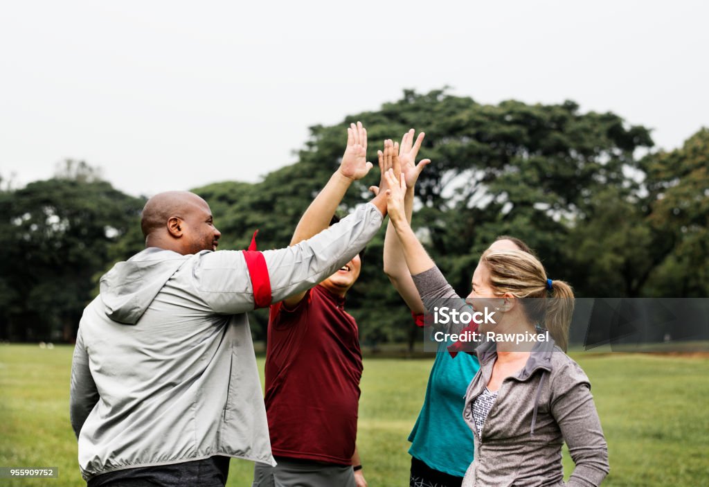 Diverse people making a high five Exercising Stock Photo