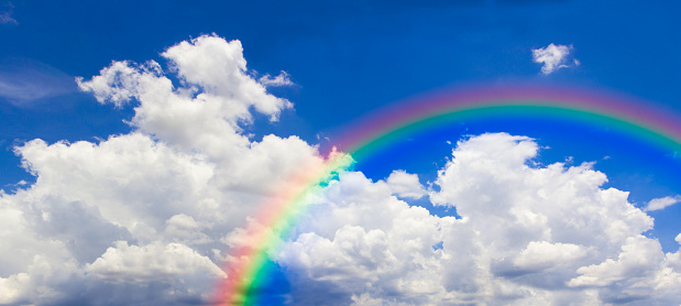 Rainbow in the dunes at Texel island in the Wadden sea region in the North of The Netherlands during a stormy autumn morning.