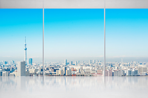 Business and design concept - empty concrete ground and window with panoramic modern urban skyline bird eye aerial day view of Tokyo, Japan, for display or mock up