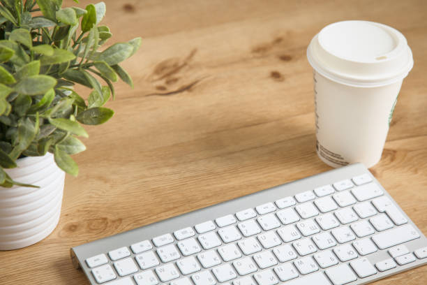 istock on the desktop computer and a cup of coffee 955920264
