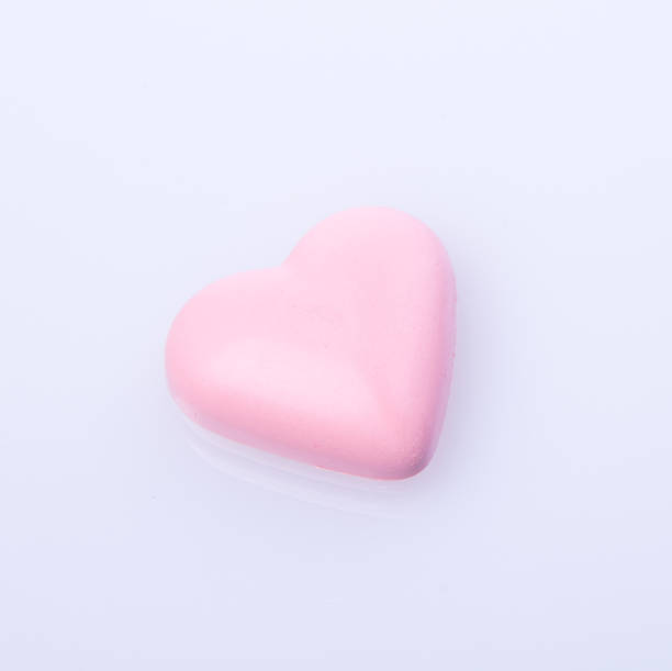 istock chocolate in pink colour or love shape chocolate 955921430