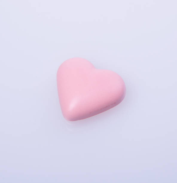 istock chocolate in pink colour or love shape chocolate 955921466