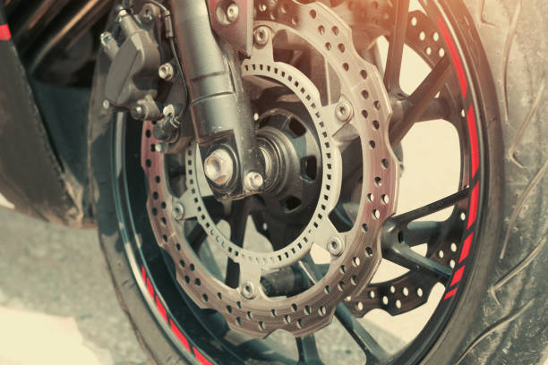 istock close up motorcycle disk brakes and tire on road 955921580