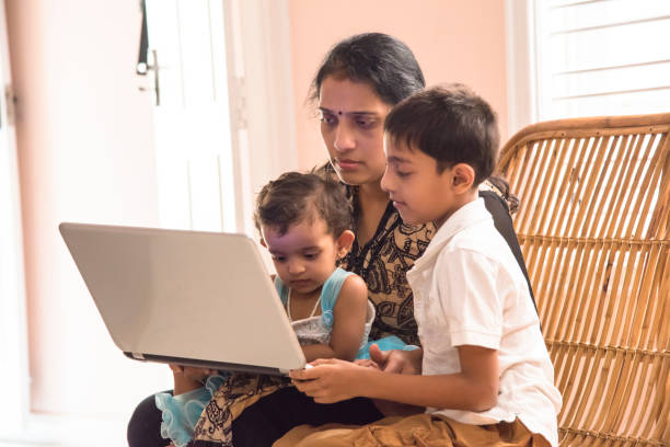 istock Indian family watching laptop 955925362