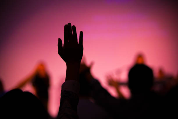 istock praise hand up in church 955925608