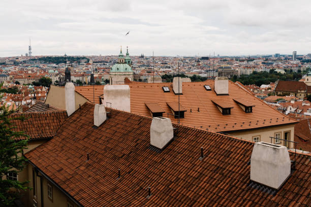 Cityscape of Prague from Mala Strana Old Royal palace with tiled roofs on foreground