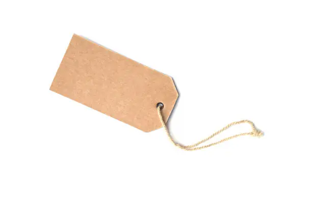 Blank brown cardboard price tag or label tag  with thread isolated.