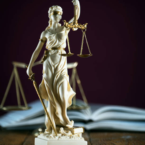 Legal office of lawyer. legal model statue of Themis goddess of justice. stock photo