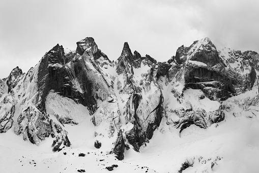 Detail of the Sciero group in the Rhaetian  Alps in Switzerland. Black and white fine art mountain winter