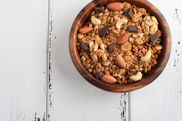 istock granola close up isolated on white background. 955948254