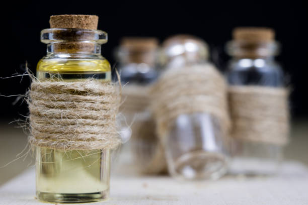Healing syrup during influenza. Specificity of medicinal ingredients in a small bottle. Light background.
