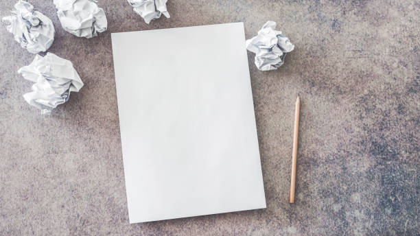 istock Empty paper with crumpled paper balls 955954052