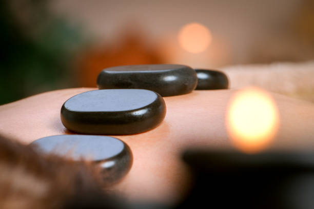 istock Young man receiving shoulder and back massage from therapist in spa 955957710