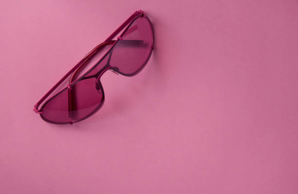 istock Pink glasses with pink background 955958302